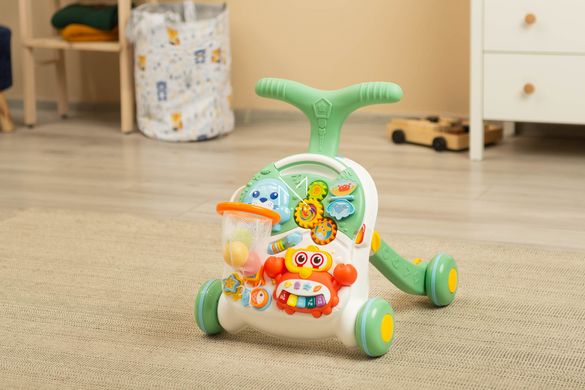 Ходунки-каталка игровой развивающий столик 2 в 1 Caretero Spark Green